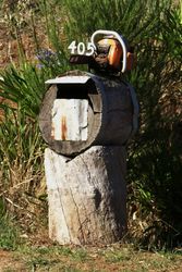 Cut through those bills with a chainsaw - log letterbox - Wilmot Tasmania